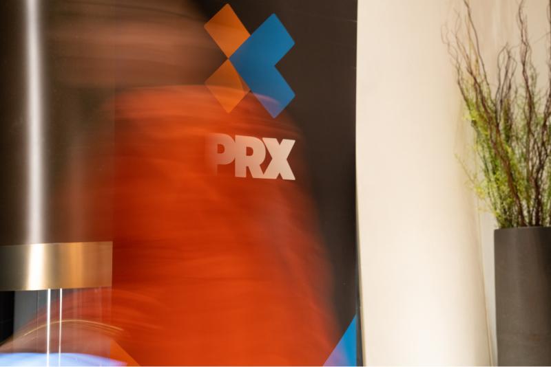 An image of the PRX logo with a moving red blur